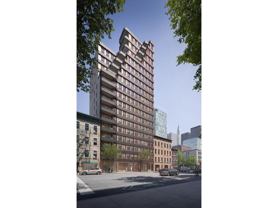 Front view of a modern multi-story building with a unique facade design.
