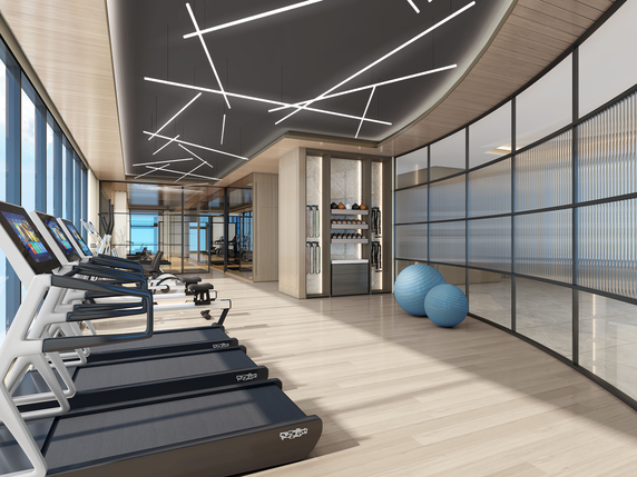 Interior view of a modern gym with treadmills and exercise equipment.