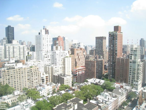 Aerial view of a cityscape with multiple high-rise buildings.