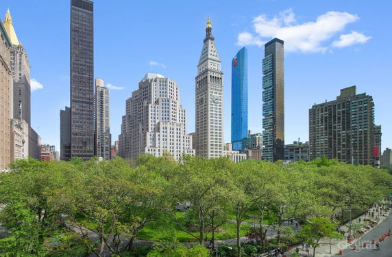 Skyline view of tall buildings and park