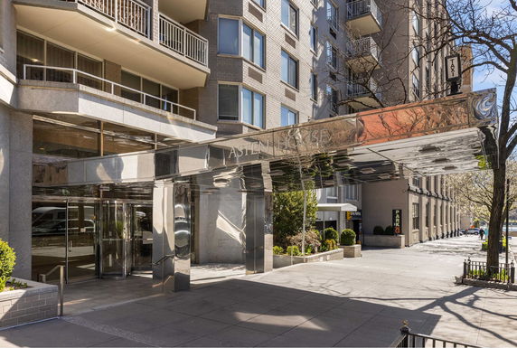 Front view of a multi-story building with a modern entrance canopy.
