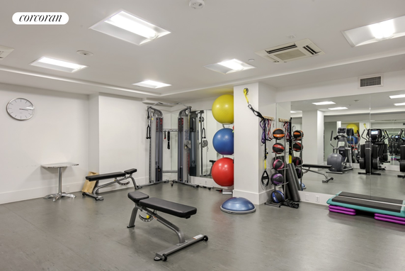 Indoor gym area with exercise equipment and fitness accessories.