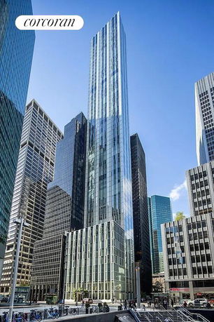 Front view of a modern skyscraper in an urban setting.