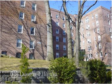 Front view of a multi-story brick apartment building