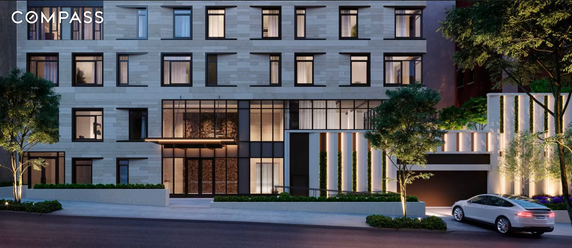 Front view of a modern multi-story building with large windows and a sleek design.