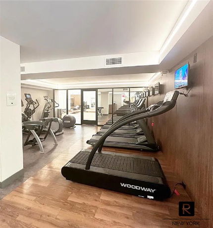 Indoor gym area with treadmills and exercise equipment.