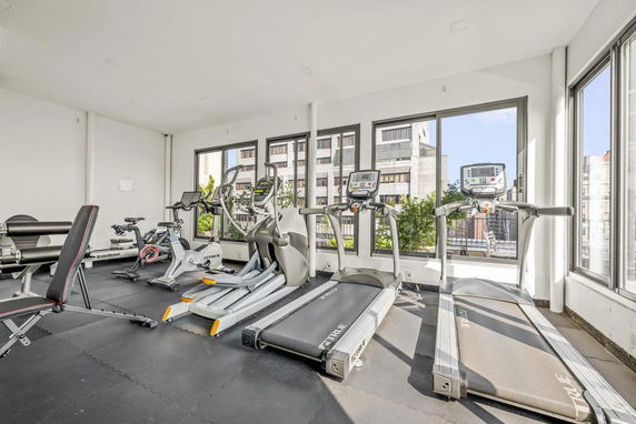 Indoor gym area with treadmills and exercise equipment.