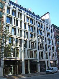 Front view of a multi-story building with a modern facade.