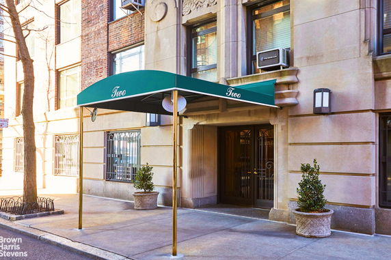 Front view of a building entrance with an overhead canopy.