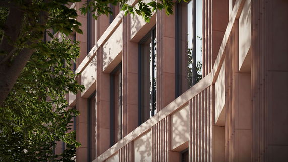 Close-up view of a modern building's facade with vertical lines and large windows.