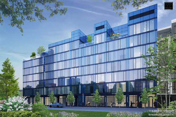 Front view of a modern multi-story glass building.