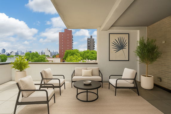 Terrace seating area with a view of city buildings and greenery.