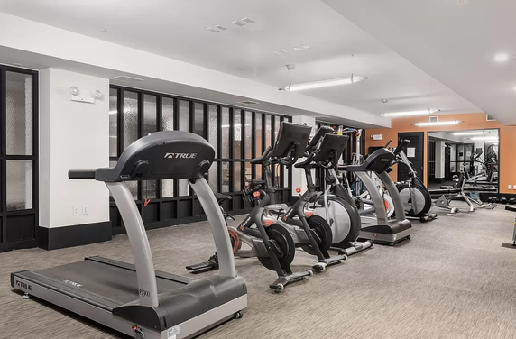 Indoor gym area with treadmills and exercise bikes.