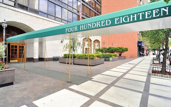 Front view of a building entrance with a canopy displaying 'Four Hundred Eighteen'.