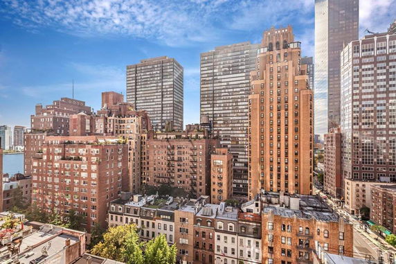 Aerial view of urban landscape with multiple high-rise buildings.