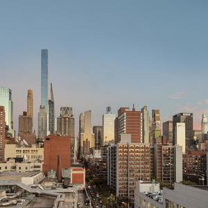 Panoramic view of a city skyline with skyscrapers and buildings.