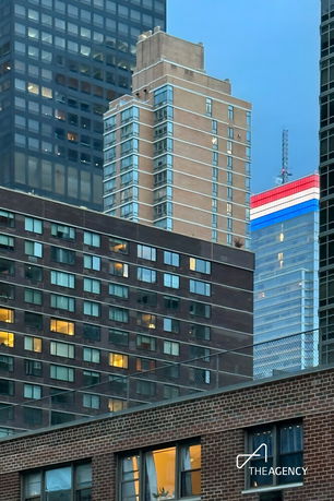 Front view of multiple high-rise buildings in an urban area.