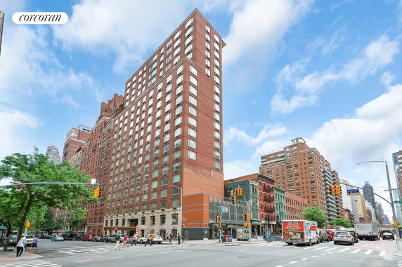 Front view of a multi-story building at an urban intersection.