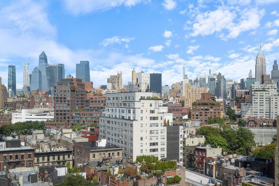 Panoramic view of a city skyline with various buildings.