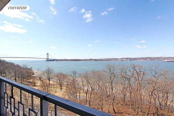 Panoramic view from a balcony overlooking a river and bridge.
