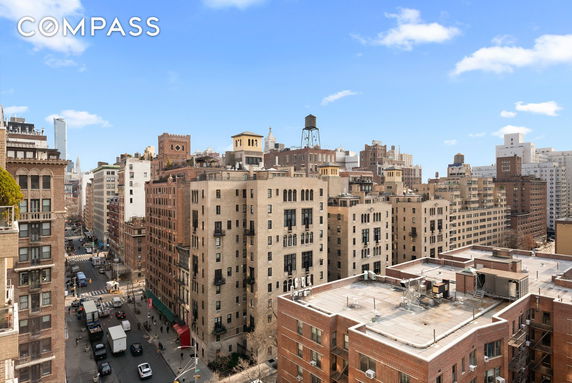 View of surrounding buildings from a high vantage point in an urban area.