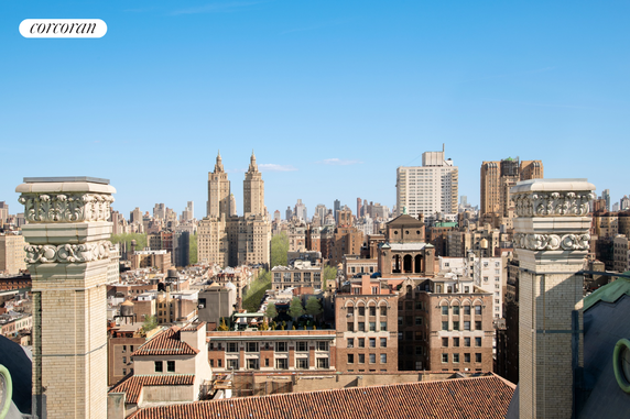 Rooftop view of a city skyline with tall buildings and architectural features.