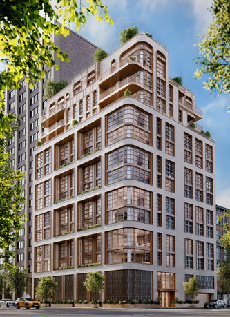 Front view of a modern multi-story building with large windows and terraces.