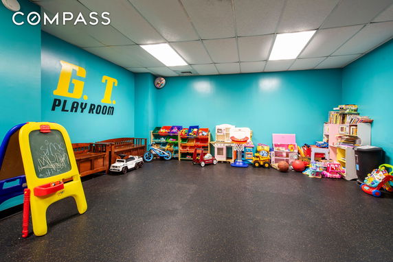 Indoor children's playroom with toys and games.
