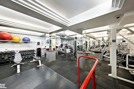Interior view of a gym with various exercise equipment.