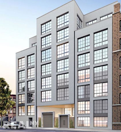 Front view of a modern multi-story building with large windows.