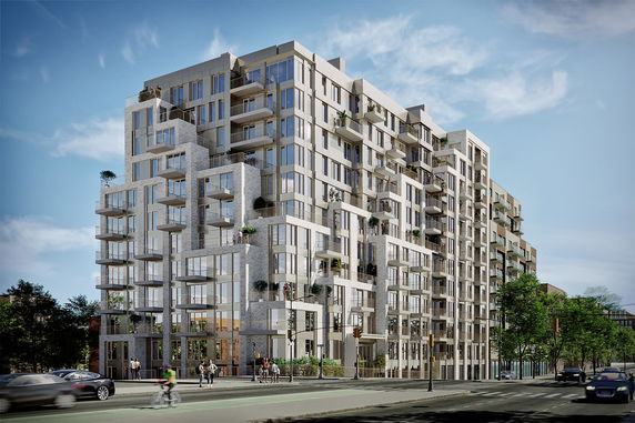 Front view of a modern multi-story apartment building with staggered balconies.