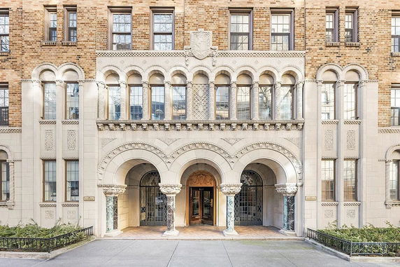 Front view of a multi-story building with intricate architectural details.