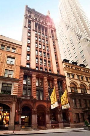 Front view of a multi-story building with ornate architectural details