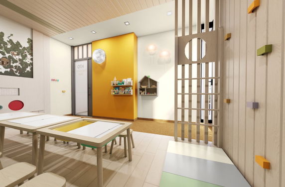 Interior view of a children's play area with tables, colorful wall decorations, and small furniture.
