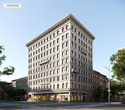 Front view of a multi-story building with classical architecture.