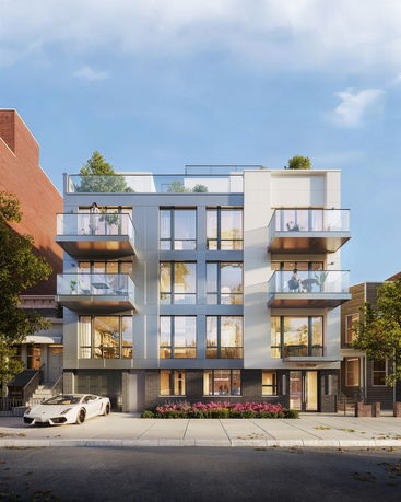 Front view of a modern multi-story apartment building with balconies.