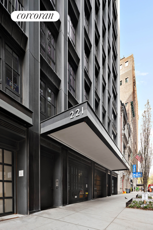 Front view of a multi-story building with a modern exterior design and large windows.
