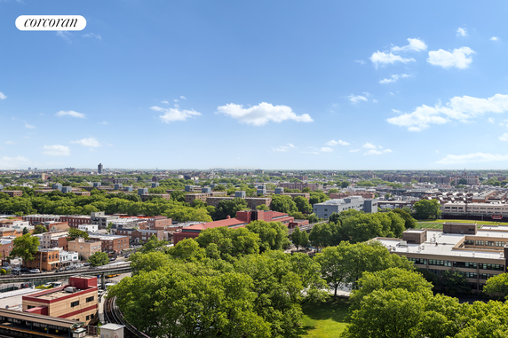 Panoramic view of a city with buildings and trees.