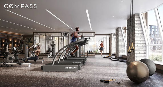 Interior view of a modern gym with various exercise equipment.