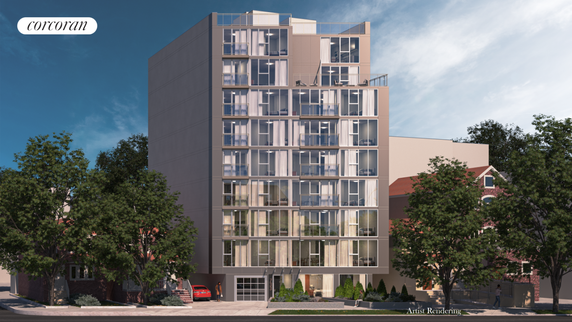 Front view of a modern multi-story apartment building with large glass windows and a rooftop area.