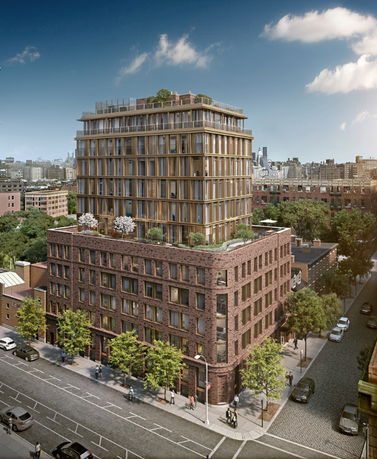 Front view of a multi-story building with brick and glass facade.