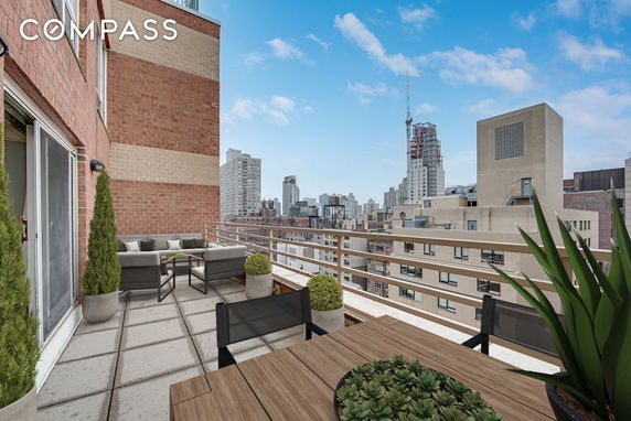 Panoramic view of a cityscape from a building balcony.