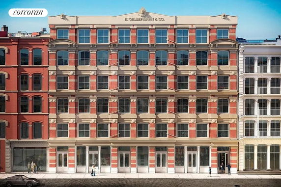 Front view of a multi-story brick building with large windows.