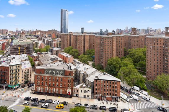 View of a cityscape with tall residential buildings and skyline in the background.