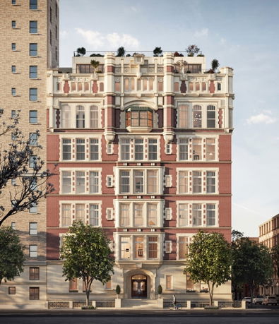 Front view of a multi-story brick building with detailed architectural design.