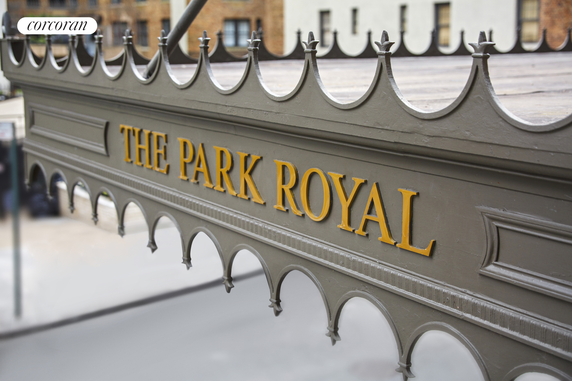 Front view of a building named 'The Park Royal' with decorative metalwork.