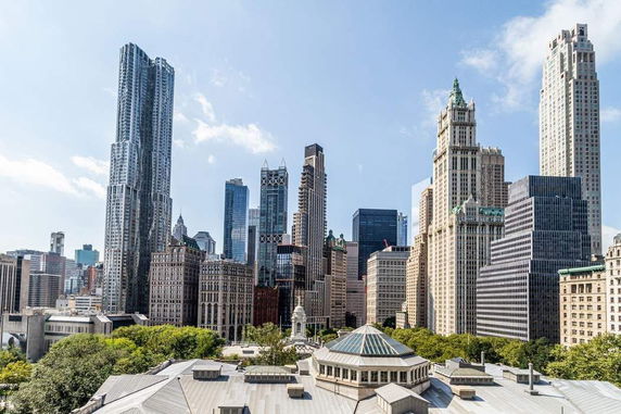 View of city skyline with multiple skyscrapers.