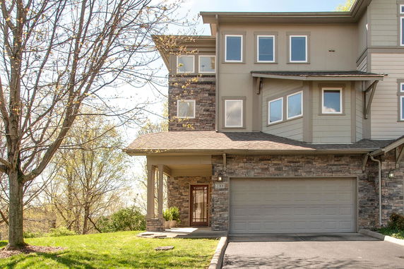 Front view of a multi-story house with a double garage.