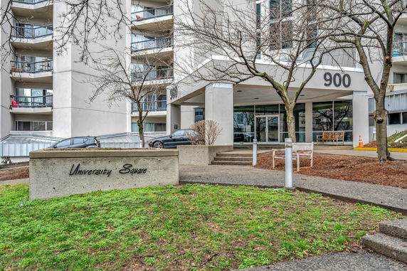 Front view of a multi-story residential building named University Square.