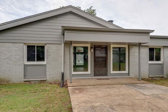 Front view of a single-story house with a covered entryway.